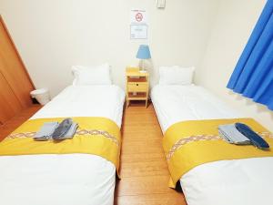 Ένα ή περισσότερα κρεβάτια σε δωμάτιο στο 池袋本町102