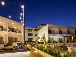 a building with a courtyard at night with lights at Nungwi Dreams by Mantis in Nungwi