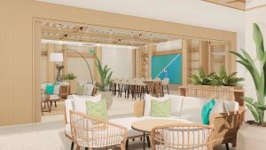 een weergave van een lobby met tafels en stoelen bij Maraleina Sports Resort in Nathon Bay