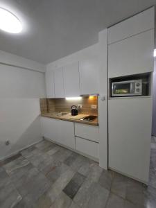 Kuchyň nebo kuchyňský kout v ubytování Apartment Sun