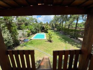 a view of a yard with a swimming pool at Casaquinta grande con pileta y parrilla in Camba Punta