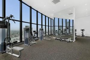 a gym with a view of the skyscraper at Sky-High Villa with Wide Ocean Views - Pet Friendly in Gold Coast