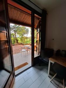 an open door to a patio with a table at TartaRigo b&b in Bologna