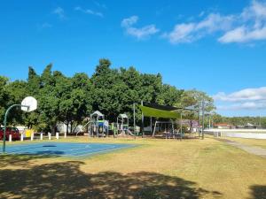 a park with a basketball court and a playground at Welcome to your leafy retreat in Graceville! in Brisbane +8 photos