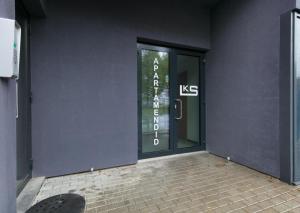 an entrance to a building with a glass door at LKS apartments 2 in Koze +3 photos