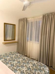 a bedroom with a bed and a window at nulacaz in Rose Hill