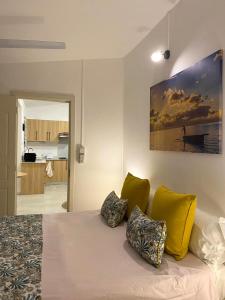 a bedroom with a bed with two pillows on it at nulacaz in Rose Hill