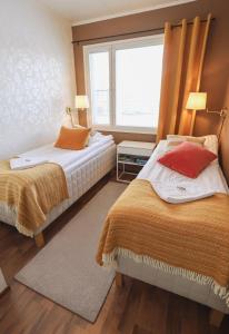 Ένα ή περισσότερα κρεβάτια σε δωμάτιο στο Aurora Apartment Kilpisjärvi