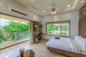 Postel nebo postele na pokoji v ubytování Aveda Juniper Resort