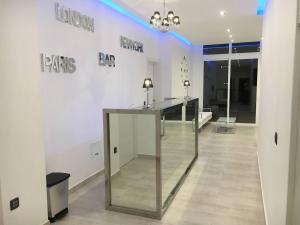 a white room with a table and signs on the wall at Villa Sunset View Tenerife, Simply Amazing in Adeje +25 photos