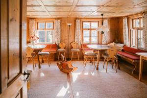 a living room with a table and chairs at Hus Sigritta in Vandans