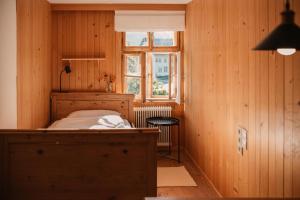 a bedroom with a bed and a window at Hus Sigritta in Vandans