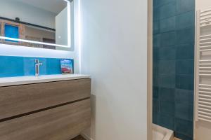 a bathroom with a sink and a mirror at Maison de charme à Lorgues in Lorgues +26 photos