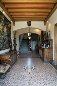 a hallway with a staircase in a house at Château des Faugs in Boffres +122 photos