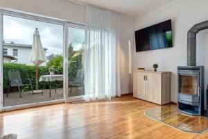 Una televisión o centro de entretenimiento en Villa Stranddistel, Whg 1