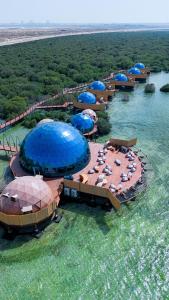 an aerial view of a resort in the water at Luxeglamp in Umm Al Quwain