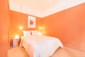 Postel nebo postele na pokoji v ubytování Jardim Suites by Olala Homes