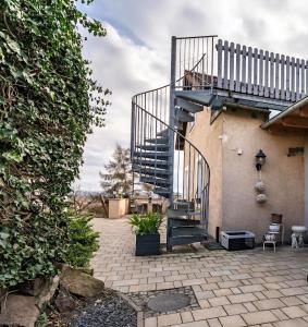 a staircase on the side of a house at Blick über Dresden - Terrasse - 3 Zimmer - modern renoviert in Dresden
