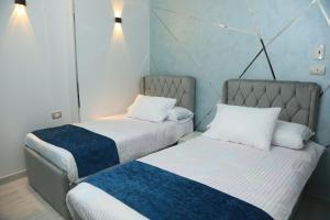 Ένα ή περισσότερα κρεβάτια σε δωμάτιο στο Crystala 2 Guest House