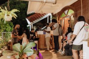 a group of people standing around in a bar at Backspace Anjuna Beach in Anjuna