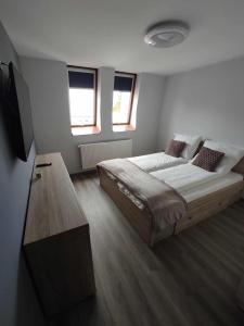 En eller flere senge i et værelse på Ági kuckó - Saját garázzsal