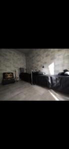a room with a bed and a brick wall at Hotel Transilvania  +15 photos