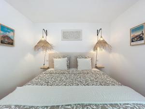 a bedroom with a large bed with two pillows at Suite parentale située dans le triangle d'or du Luberon in Ménerbes +15 photos