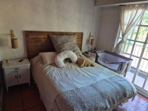 a bedroom with a bed with a towel on it at Casa lago lacar in Bella Vista +28 photos