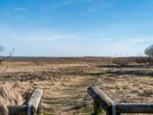a fence in the middle of a field at 6 person holiday home in Hadsund in Hadsund