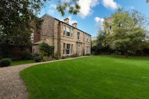 an old stone house with a large yard at The Vicarage in Billingham