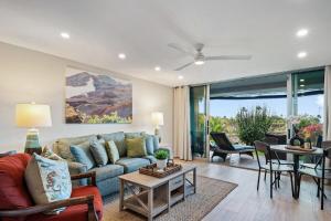a living room with a couch and a table at Eldorado K104 · EL K104 Spacious 1BD w Near Beach in Kahana