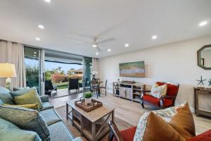 a living room with couches and a table at Eldorado K104 · EL K104 Spacious 1BD w Near Beach in Kahana