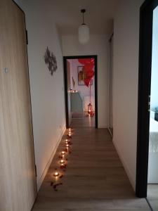 a hallway with a row of lights on the floor at Apartament Monte Ślęża & Spa in Sobótka
