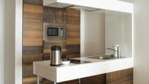 Kuchyň nebo kuchyňský kout v ubytování VacationClub - Baltic Park Molo Apartament D106