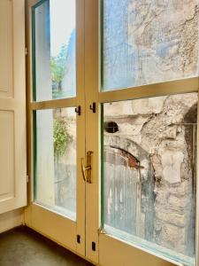 a window in a room with a stone wall at Casa Genovesi 5 in Salerno