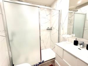 a bathroom with a shower and a sink at Stella Marina by Holiday World in Varazze +11 photos