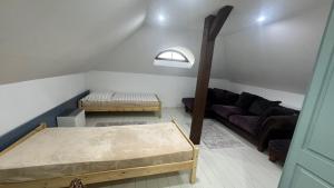 a living room with a couch and a table at Sancta Katharina in Rozvadov