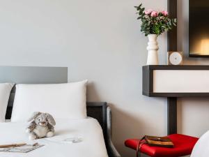 Postel nebo postele na pokoji v ubytování Mercure Paris CDG Airport & Convention + 98 fotografií