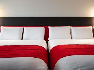 Postel nebo postele na pokoji v ubytování Mercure Paris CDG Airport & Convention