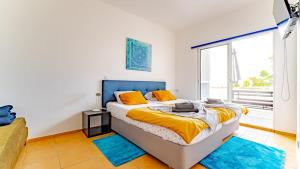 a bedroom with a bed and a large window at INN Mountain Country House in Caniço +212 photos