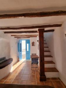 a hallway with a staircase in a house at Casa Romero in Cortes de la Frontera