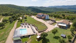 an aerial view of a house with a swimming pool at Villa Setona by VacaVilla in Bucine