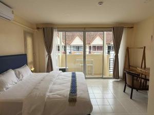 Ένα ή περισσότερα κρεβάτια σε δωμάτιο στο Kata Kata Stay +29 φωτογραφίες