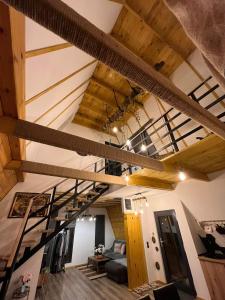 a loft with a staircase in a room at Challet in Cheia