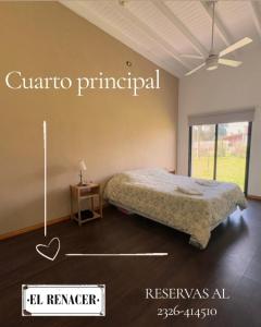 a bedroom with a bed in a room with a window at El Renacer Duggan in Duggan