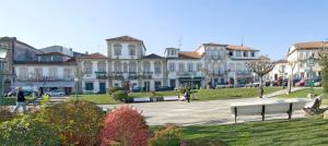 a large building with a park in front of it at AL - Casa 42 in Monção