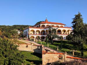 a large house on top of a hill at Haus Einhorn in Nenningen
