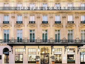 a facade of a building with windows and balconies at Sofitel Le Scribe Paris Opera in Paris