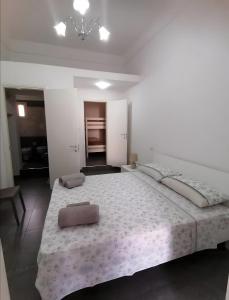 a large bed in a white room with a large mattress at Casa Vacanze Lu Rizzaru in Nardò