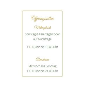 a white wedding invitation with gold calligraphy at Hotel Riegeler Hof in Riegel am Kaiserstuhl